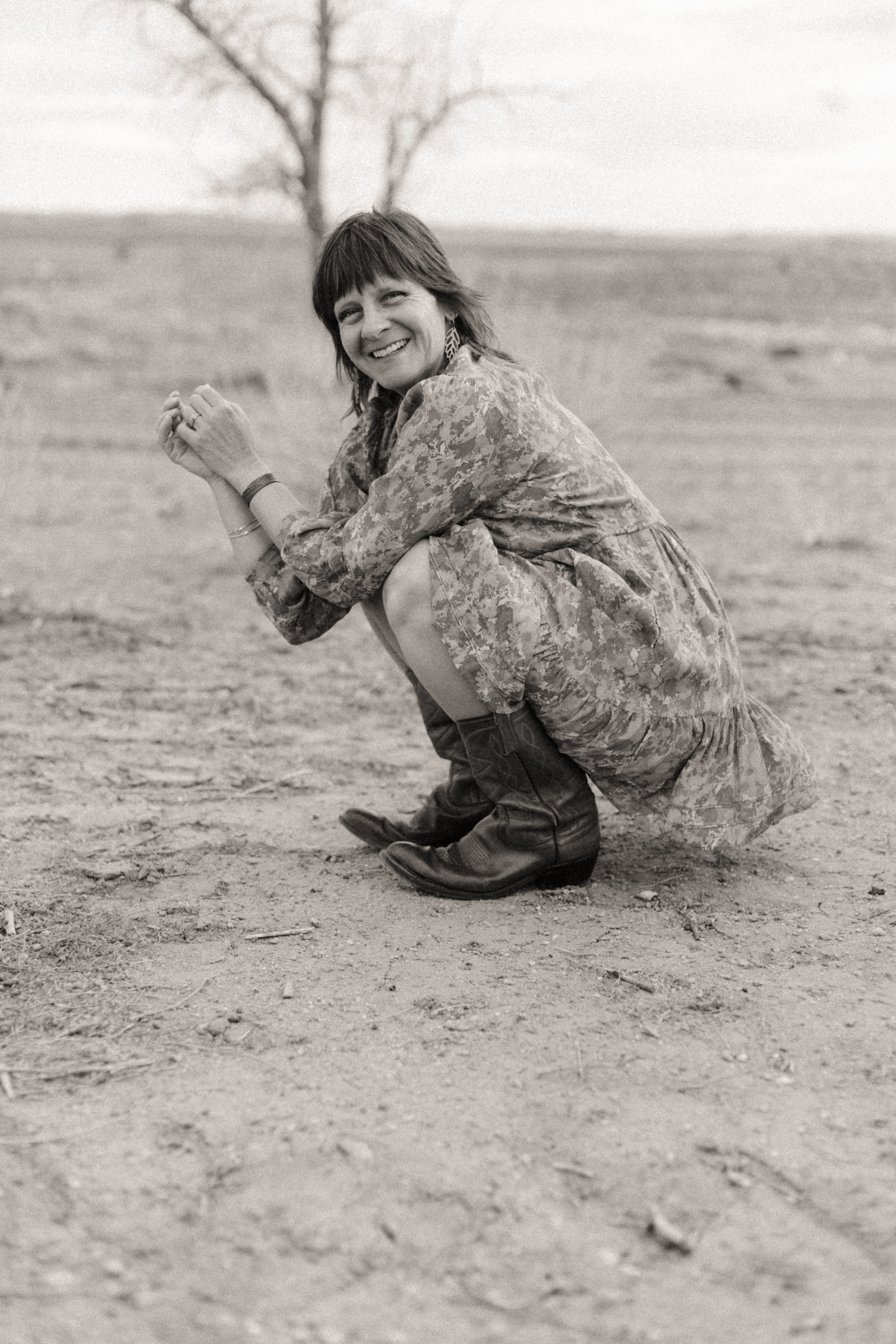 Emily Nava laughing in a field